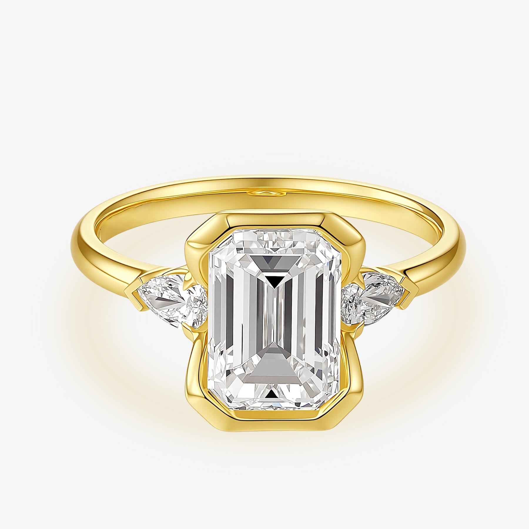Front view of the Emerald Heirloom Trio lab-grown diamond engagement ring with an emerald-cut center diamond and two side diamonds