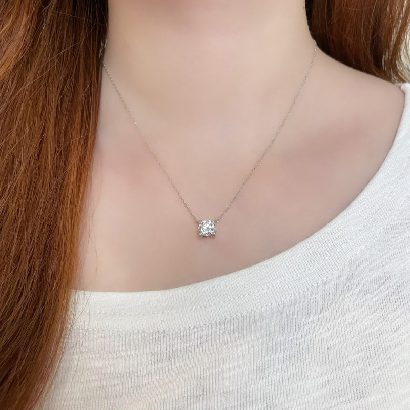 Model wearing the Geometric Solitaire round lab-grown diamond pendant necklace