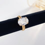 Close-up of the Golden Oval lab-grown diamond engagement ring with an oval center diamond and textured yellow gold band