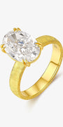 Golden Oval solitaire lab-grown diamond engagement ring with an oval-cut center diamond in a textured yellow gold band