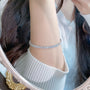 Princess cut lab-grown diamond tennis bracelet worn on wrist lifestyle view