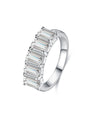 Angled view of the Luminous Five emerald cut lab-grown diamond band ring in a polished white metal setting