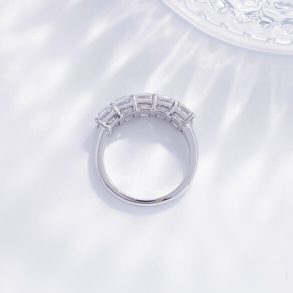 Back view of the Luminous Five emerald cut lab-grown diamond band ring showing the open gallery setting