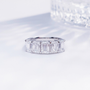 Front view of the Luminous Five emerald cut lab-grown diamond band ring with five diamonds in a clean row