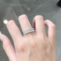 Model wearing the Luminous Five emerald cut lab-grown diamond band ring