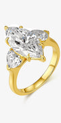 Marquise Grace Trio lab-grown diamond engagement ring with a marquise-cut center diamond and heart-shaped side stones in a warm gold setting