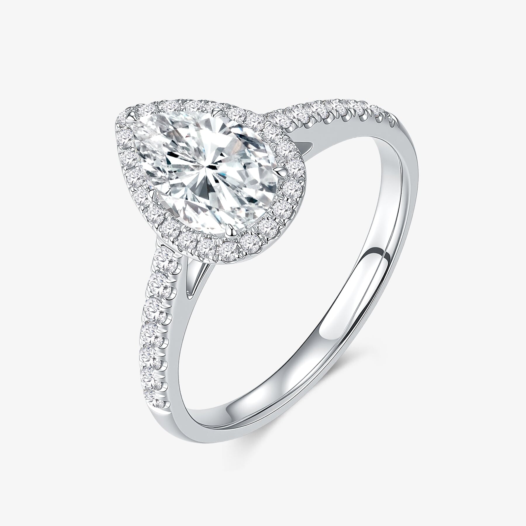 Pear Halo lab-grown diamond engagement ring with a pear-cut center diamond, round diamond halo, and pavé-set band