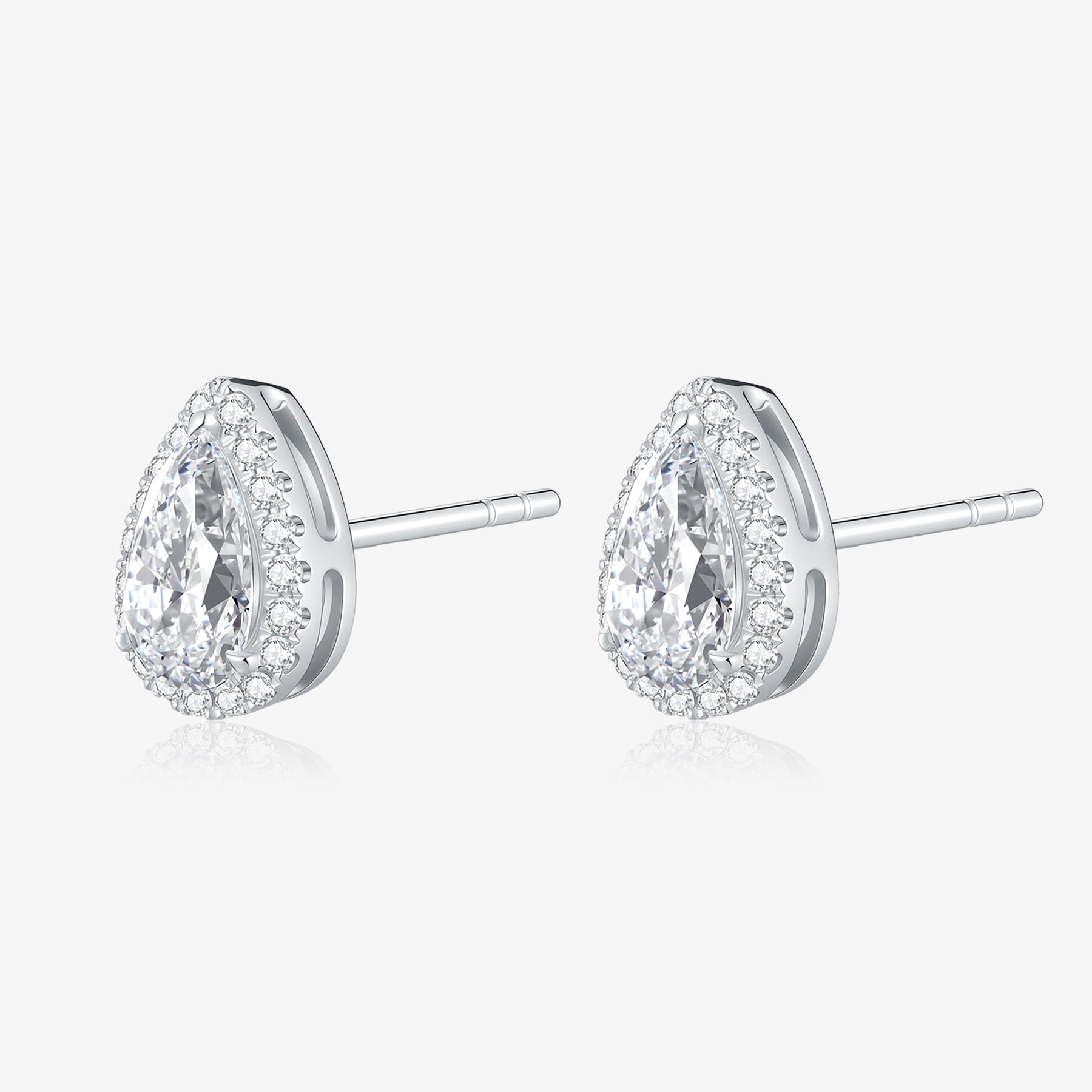 Angled view of Pear Halo lab-grown diamond stud earrings with pear-cut center diamonds surrounded by round diamonds