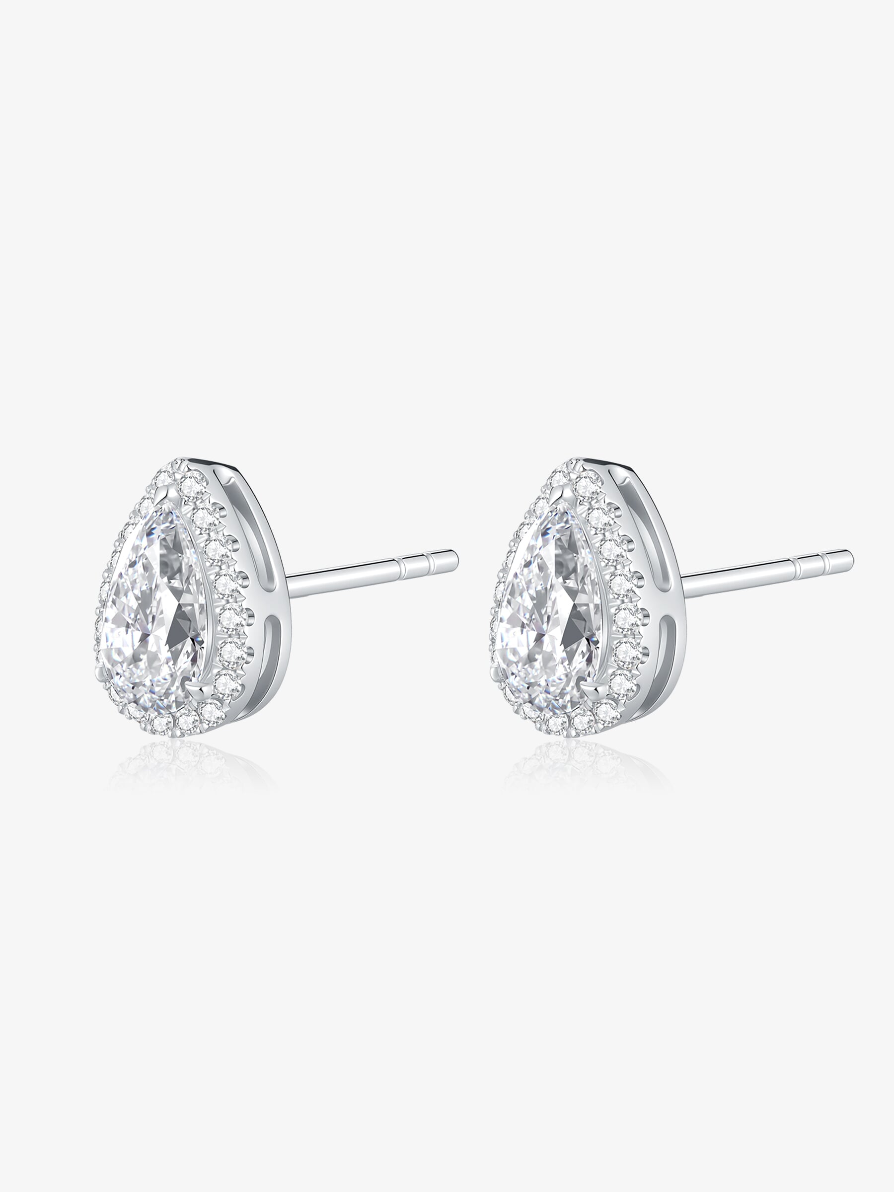 Angled view of Pear Halo lab-grown diamond stud earrings with pear-cut center diamonds surrounded by round diamonds