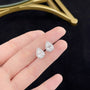 Close-up of Pear Halo lab-grown diamond stud earrings with pear-cut diamonds and round diamond halos