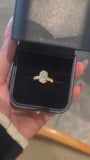 Video of the Golden Oval solitaire lab-grown diamond engagement ring in its jewelry box, featuring an oval-cut center diamond and textured yellow gold band