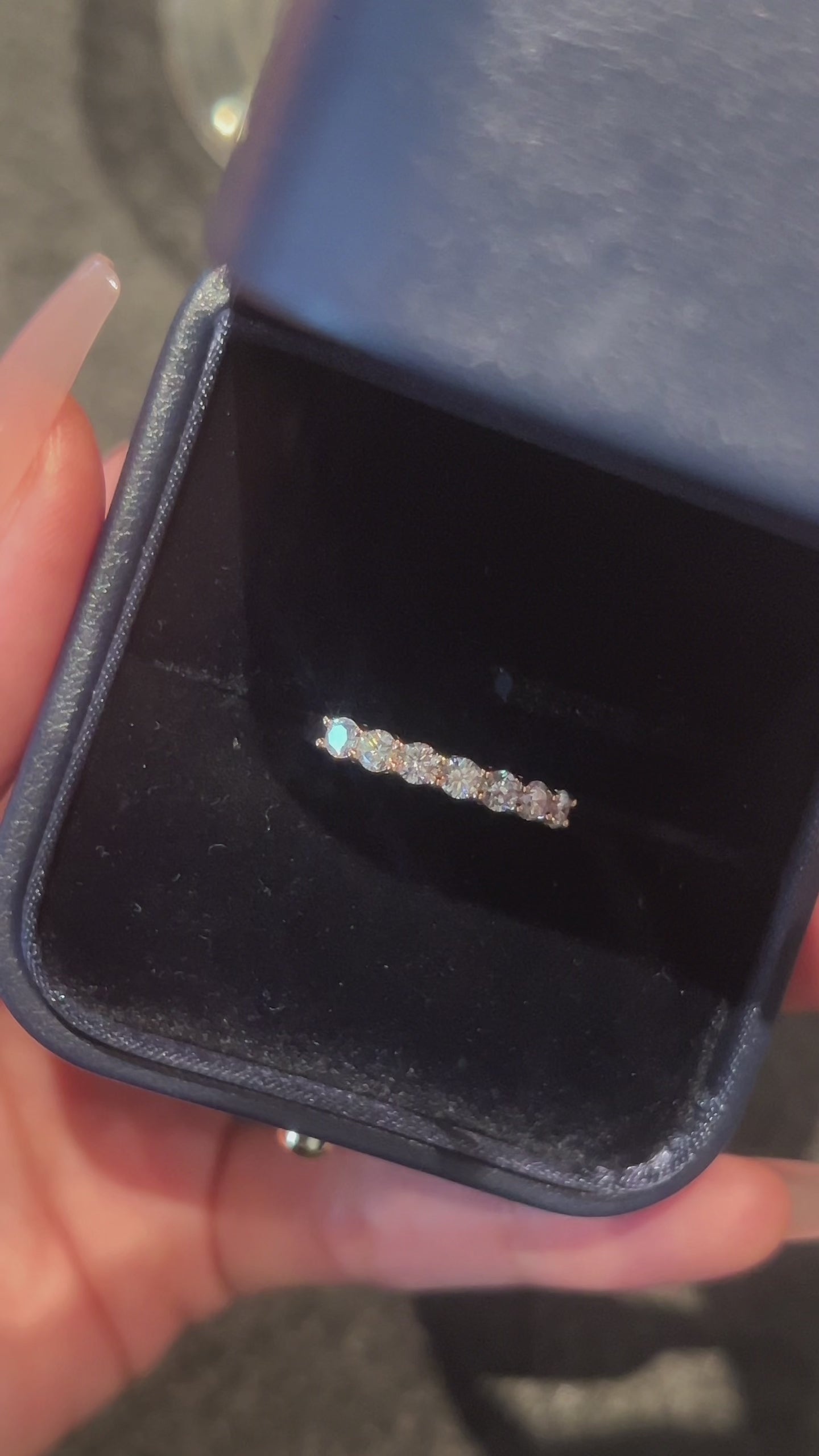 Video of the Arc Light round lab-grown diamond band ring featuring a row of round brilliant lab-grown diamonds