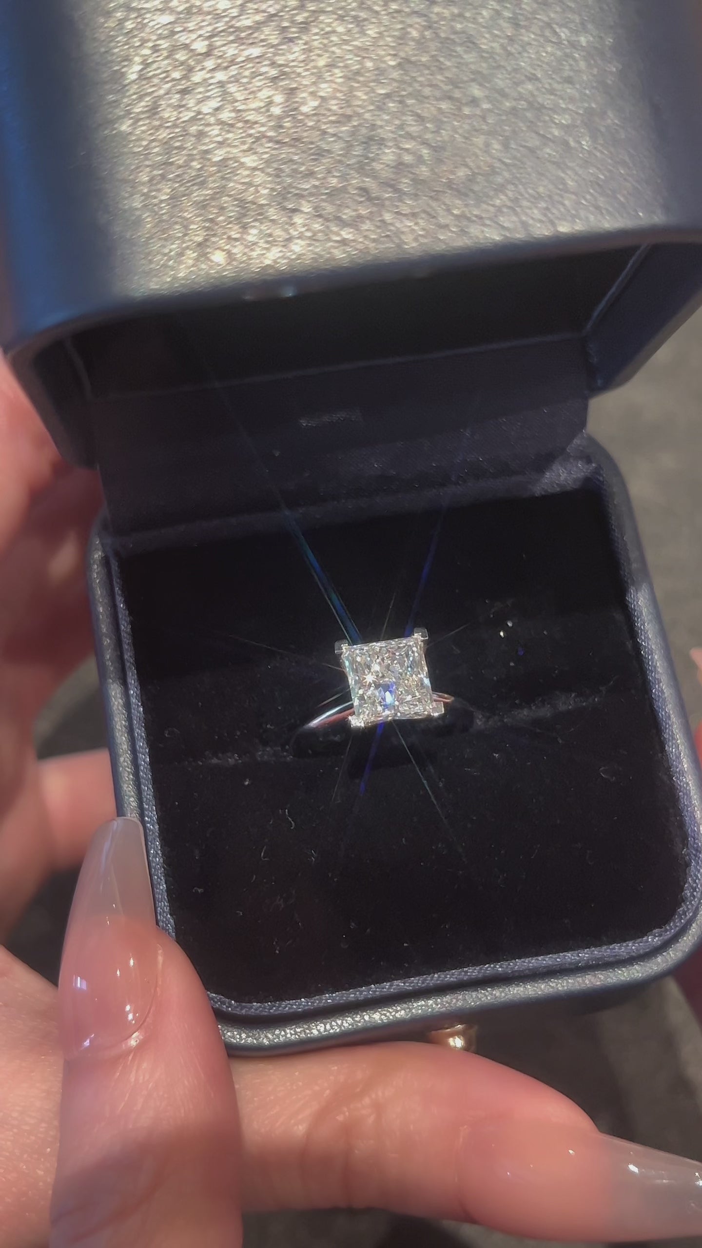Video of the Princess Cut Solitaire lab-grown diamond engagement ring featuring a square center diamond in a polished four-prong setting