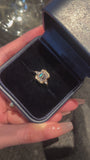 Video of the Emerald Heirloom Trio lab-grown diamond engagement ring featuring an emerald-cut center diamond and delicate side diamonds