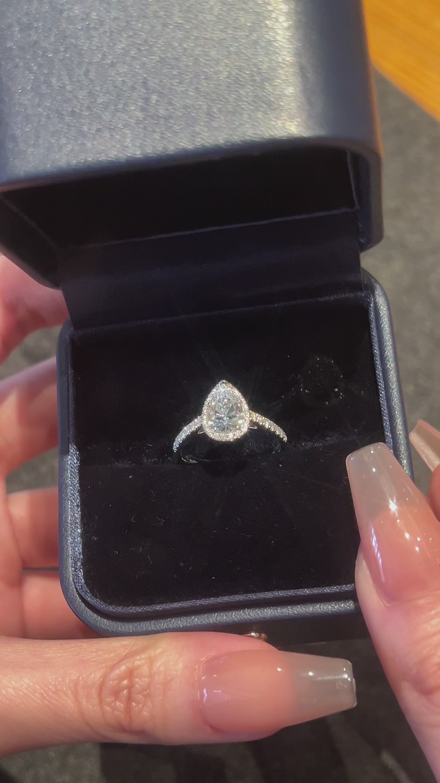 Video of the Pear Halo lab-grown diamond engagement ring featuring a pear-cut center diamond, round diamond halo, and pavé-set band