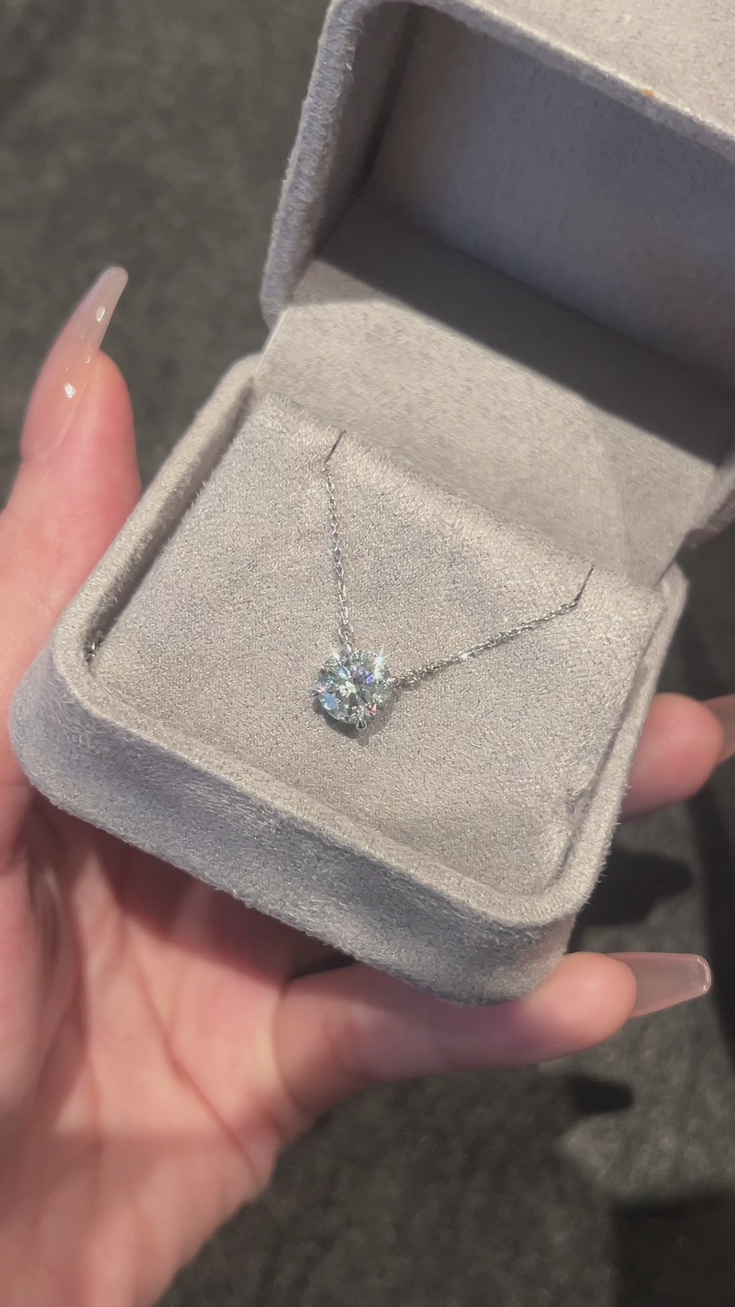 Video of the Classic Solitaire round lab-grown diamond pendant necklace in its jewelry box, featuring a round brilliant diamond in a four-prong setting
