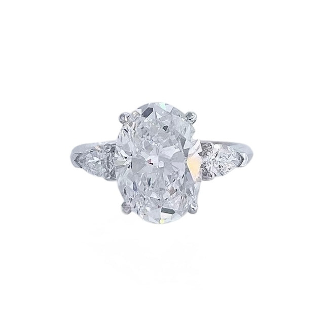 Detail view of the Soft Oval Trio lab-grown diamond engagement ring with an oval-cut center diamond