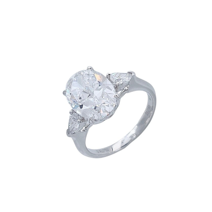 Soft Oval Trio lab-grown diamond engagement ring with an oval-cut center diamond and delicate side stones