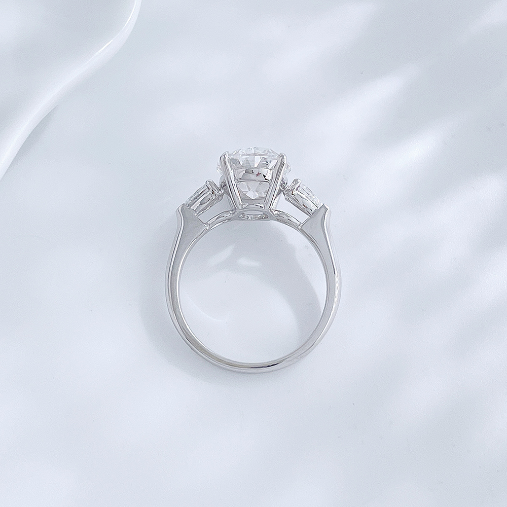 Side view of the Soft Oval Trio lab-grown diamond engagement ring showing the oval center diamond and side stones